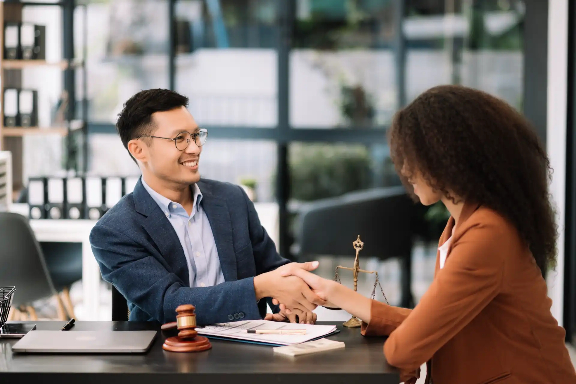 business team and lawyers discussing contract paper